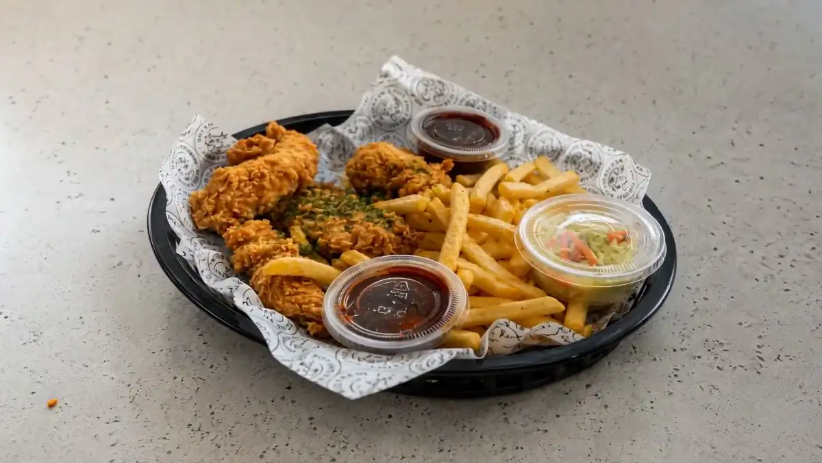 Kokio Korean fried chicken and waffle fries in a basket