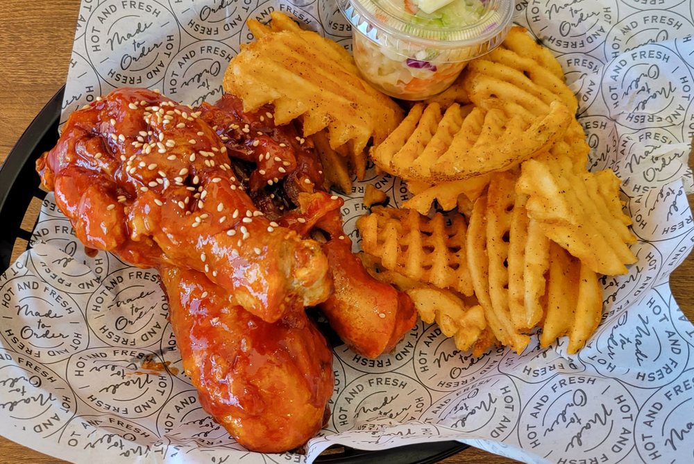 Korean fried chicken with waffle fries and coleslaw