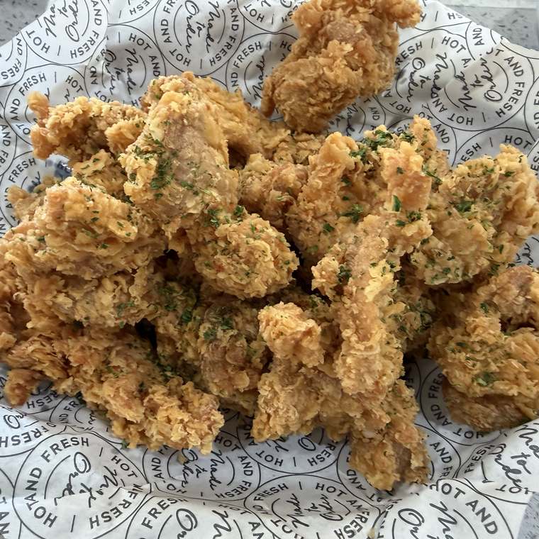 Basket of Kokio boneless fried chicken, golden and herb-dusted